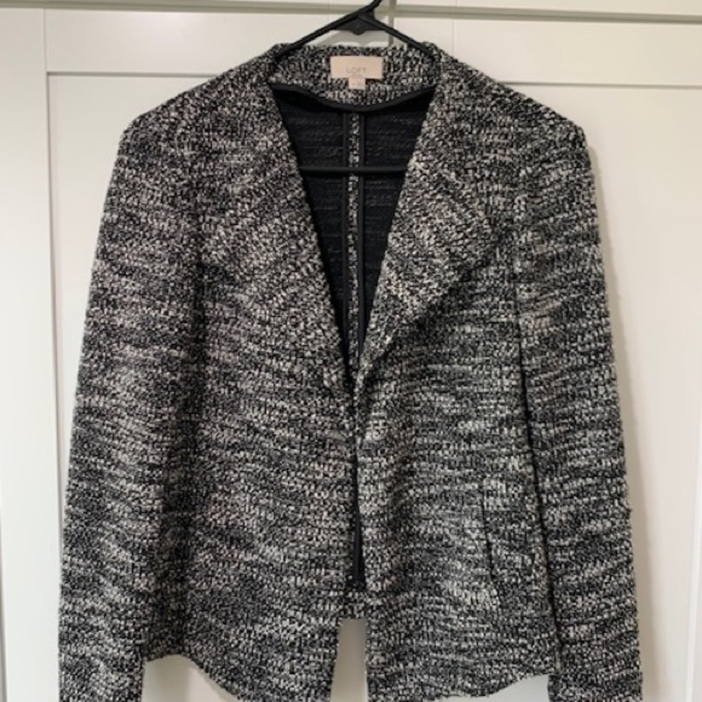 Loft black & ivory knit jacket size SP long sleeves. Front slash zip pockets.